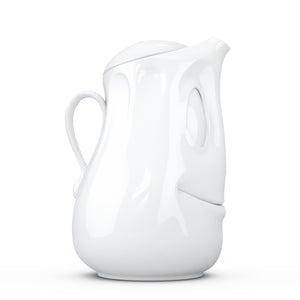 Porcelain tea pot in white featuring a 'good mood' facial expression and a generous 40 oz. capacity. Perfect for serving tea, coffee, punch, mulled wine and more. Detailed facial expression tea pot from the TASSEN product family of fun dishware by FIFTYEIGHT Products. Shipped in exclusively designed gift box.