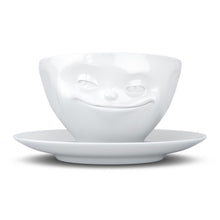 Load image into Gallery viewer, Coffee cup with a &#39;grinning&#39; facial expression and 6.5 oz capacity. From the TASSEN product family of fun dishware by FIFTYEIGHT Products. Coffee cup with matching saucer crafted from quality porcelain.
