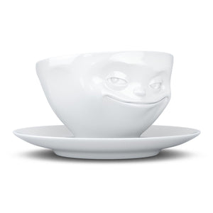 Coffee cup with a 'grinning' facial expression and 6.5 oz capacity. From the TASSEN product family of fun dishware by FIFTYEIGHT Products. Coffee cup with matching saucer crafted from quality porcelain.