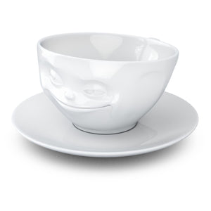 Coffee cup with a 'grinning' facial expression and 6.5 oz capacity. From the TASSEN product family of fun dishware by FIFTYEIGHT Products. Coffee cup with matching saucer crafted from quality porcelain.