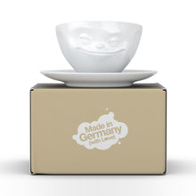Load image into Gallery viewer, Coffee cup with a &#39;grinning&#39; facial expression and 6.5 oz capacity. From the TASSEN product family of fun dishware by FIFTYEIGHT Products. Coffee cup with matching saucer crafted from quality porcelain.

