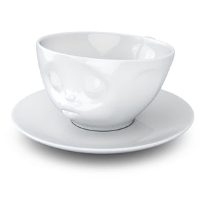 Coffee cup with a 'kissing' facial expression and 6.5 oz capacity. From the TASSEN product family of fun dishware by FIFTYEIGHT Products. Coffee cup with matching saucer crafted from quality porcelain.