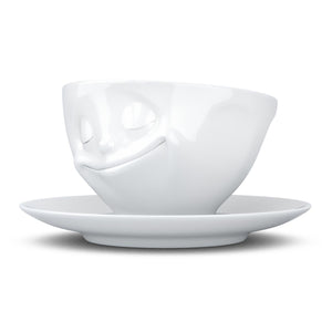 Coffee cup with a 'happy' facial expression and 6.5 oz capacity. From the TASSEN product family of fun dishware by FIFTYEIGHT Products. Coffee cup with matching saucer crafted from quality porcelain.