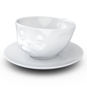 Coffee cup with a 'snoozy' facial expression and 6.5 oz capacity. From the TASSEN product family of fun dishware by FIFTYEIGHT Products. Coffee cup with matching saucer crafted from quality porcelain.