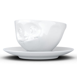 Coffee cup with a 'tasty' facial expression and 6.5 oz capacity. From the TASSEN product family of fun dishware by FIFTYEIGHT Products. Coffee cup with matching saucer crafted from quality porcelain.