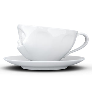 Coffee cup with a 'tasty' facial expression and 6.5 oz capacity. From the TASSEN product family of fun dishware by FIFTYEIGHT Products. Coffee cup with matching saucer crafted from quality porcelain.