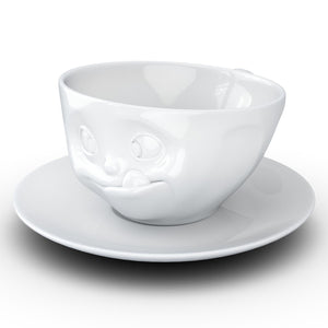 Coffee cup with a 'tasty' facial expression and 6.5 oz capacity. From the TASSEN product family of fun dishware by FIFTYEIGHT Products. Coffee cup with matching saucer crafted from quality porcelain.