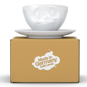 Coffee cup with a 'tasty' facial expression and 6.5 oz capacity. From the TASSEN product family of fun dishware by FIFTYEIGHT Products. Coffee cup with matching saucer crafted from quality porcelain.