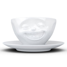 Load image into Gallery viewer, Coffee cup with a &#39;laughing&#39; facial expression and 6.5 oz capacity. From the TASSEN product family of fun dishware by FIFTYEIGHT Products. Coffee cup with matching saucer crafted from quality porcelain.
