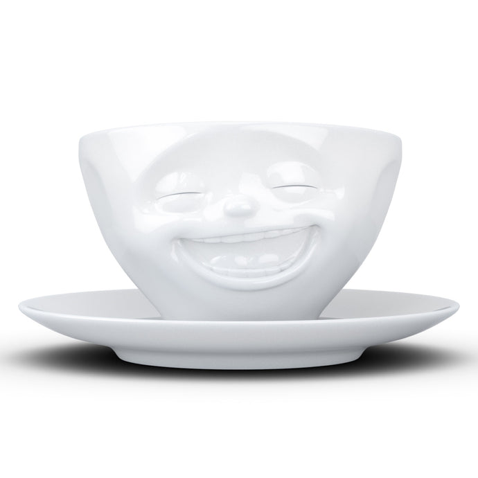 Coffee cup with a 'laughing' facial expression and 6.5 oz capacity. From the TASSEN product family of fun dishware by FIFTYEIGHT Products. Coffee cup with matching saucer crafted from quality porcelain.