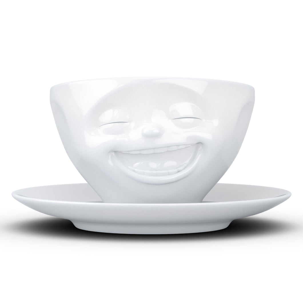 Coffee cup with a 'laughing' facial expression and 6.5 oz capacity. From the TASSEN product family of fun dishware by FIFTYEIGHT Products. Coffee cup with matching saucer crafted from quality porcelain.