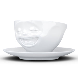 Coffee cup with a 'laughing' facial expression and 6.5 oz capacity. From the TASSEN product family of fun dishware by FIFTYEIGHT Products. Coffee cup with matching saucer crafted from quality porcelain.