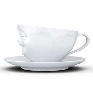 Coffee cup with a 'laughing' facial expression and 6.5 oz capacity. From the TASSEN product family of fun dishware by FIFTYEIGHT Products. Coffee cup with matching saucer crafted from quality porcelain.