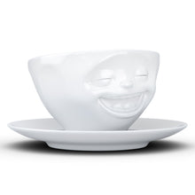 Load image into Gallery viewer, Coffee cup with a &#39;laughing&#39; facial expression and 6.5 oz capacity. From the TASSEN product family of fun dishware by FIFTYEIGHT Products. Coffee cup with matching saucer crafted from quality porcelain.
