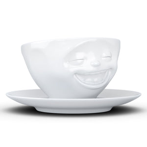 Coffee cup with a 'laughing' facial expression and 6.5 oz capacity. From the TASSEN product family of fun dishware by FIFTYEIGHT Products. Coffee cup with matching saucer crafted from quality porcelain.