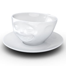Load image into Gallery viewer, Coffee cup with a &#39;laughing&#39; facial expression and 6.5 oz capacity. From the TASSEN product family of fun dishware by FIFTYEIGHT Products. Coffee cup with matching saucer crafted from quality porcelain.
