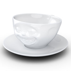Coffee cup with a 'laughing' facial expression and 6.5 oz capacity. From the TASSEN product family of fun dishware by FIFTYEIGHT Products. Coffee cup with matching saucer crafted from quality porcelain.
