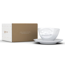 Load image into Gallery viewer, Coffee cup with a &#39;laughing&#39; facial expression and 6.5 oz capacity. From the TASSEN product family of fun dishware by FIFTYEIGHT Products. Coffee cup with matching saucer crafted from quality porcelain.
