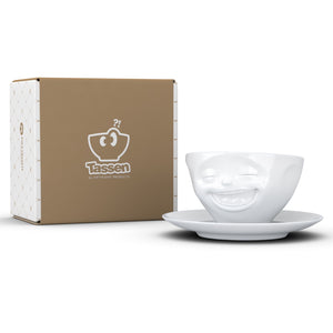 Coffee cup with a 'laughing' facial expression and 6.5 oz capacity. From the TASSEN product family of fun dishware by FIFTYEIGHT Products. Coffee cup with matching saucer crafted from quality porcelain.