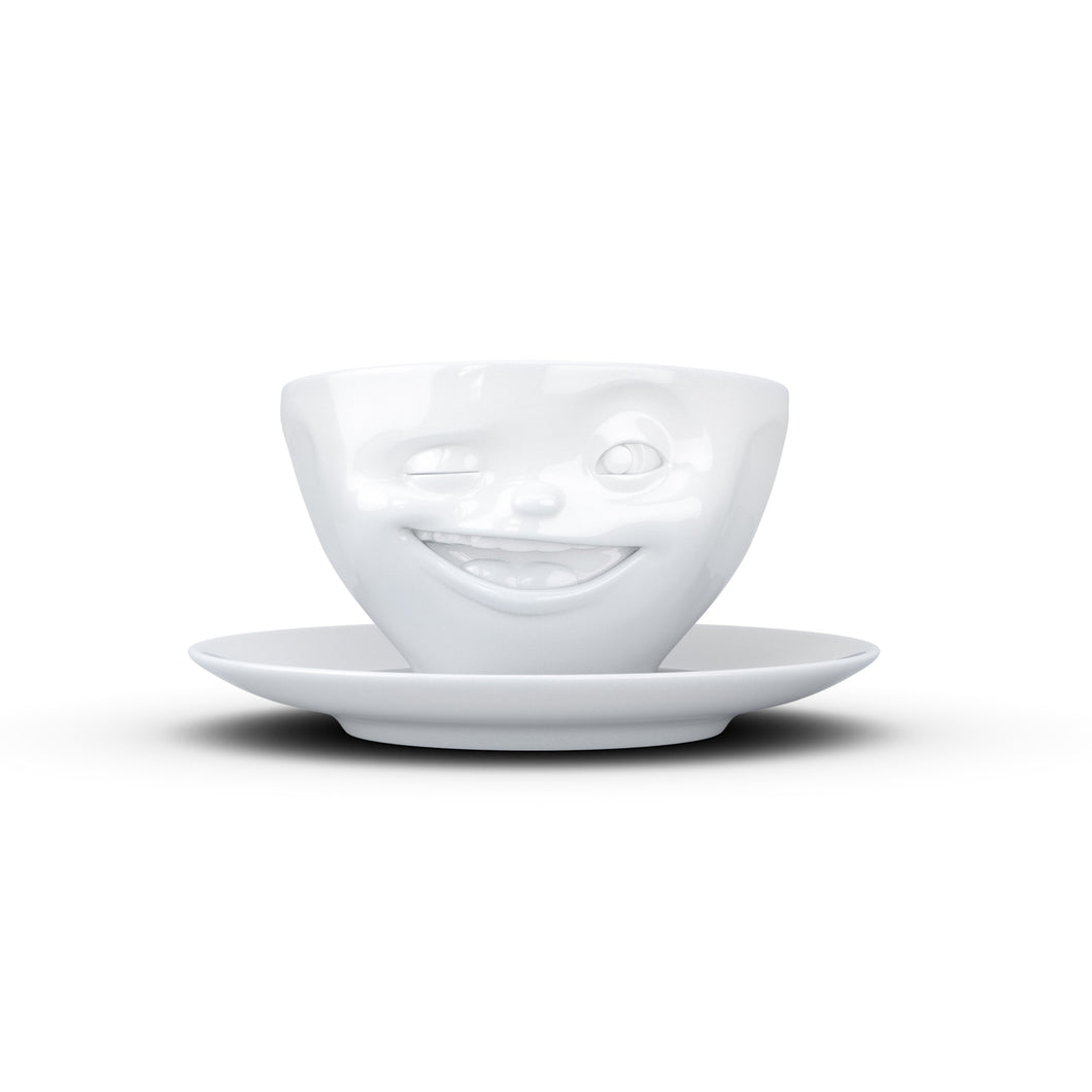 Coffee cup with a 'winking' facial expression and 6.5 oz capacity. From the TASSEN product family of fun dishware by FIFTYEIGHT Products. Coffee cup with matching saucer crafted from quality porcelain.