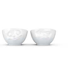 Load image into Gallery viewer, Set of two egg cups in white from the TASSEN product family of fun dishware by FIFTYEIGHT Products. Set features two egg cups in white, featuring &#39;Happy&#39; and &#39;Hmpff&#39; facial expressions. Dishwasher and microwave safe bowls. Shipped in exclusively designed gift box.
