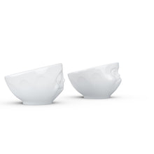 Load image into Gallery viewer, Set of two egg cups in white from the TASSEN product family of fun dishware by FIFTYEIGHT Products. Set features two egg cups in white, featuring &#39;Happy&#39; and &#39;Hmpff&#39; facial expressions. Dishwasher and microwave safe bowls. Shipped in exclusively designed gift box.
