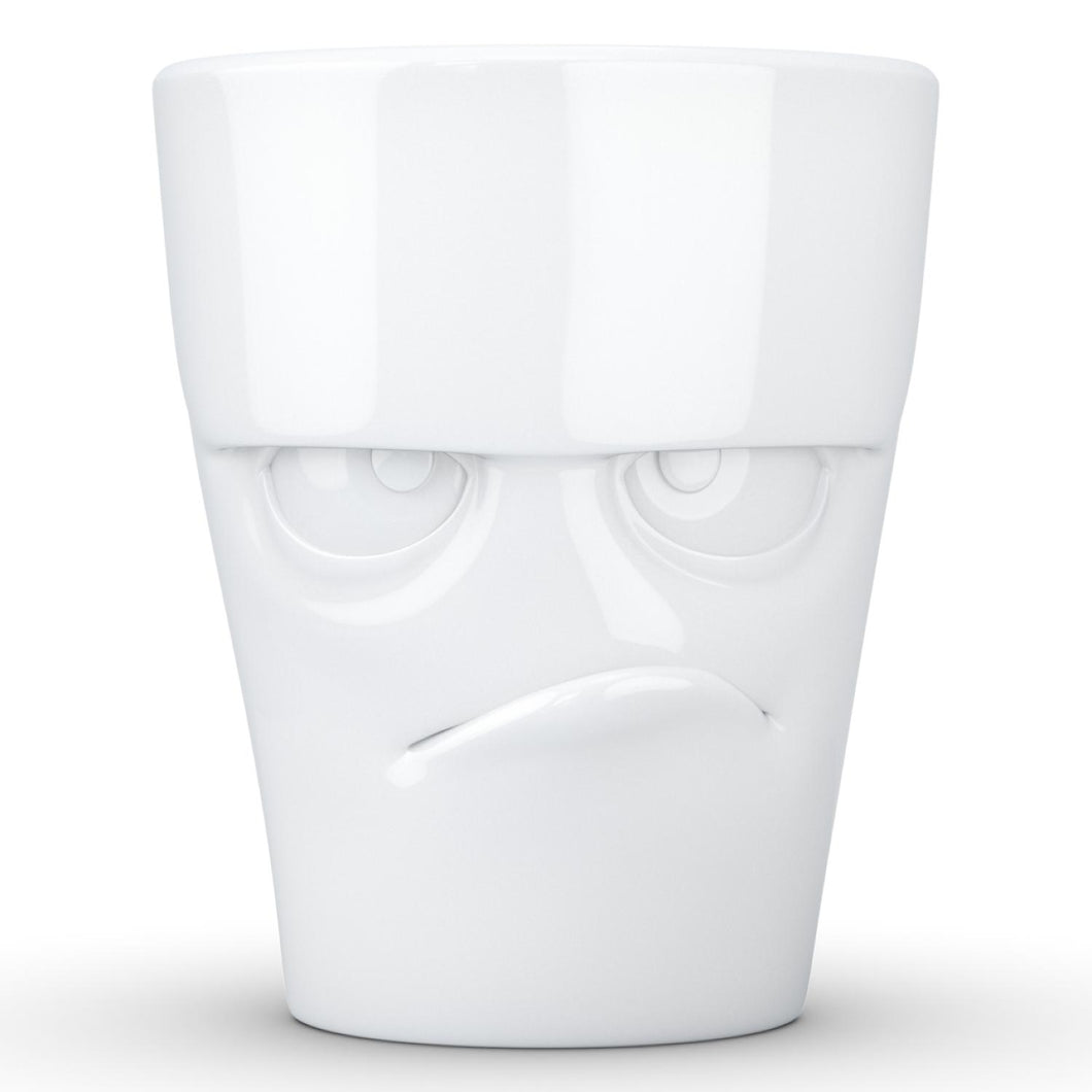 Coffee mug with 'grumpy' facial expression and 11 oz capacity. From the TASSEN product family of fun dishware by FIFTYEIGHT Products. Tall coffee cup with handle in white, crafted from quality porcelain.