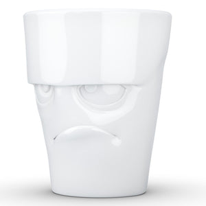 Coffee mug with 'grumpy' facial expression and 11 oz capacity. From the TASSEN product family of fun dishware by FIFTYEIGHT Products. Tall coffee cup with handle in white, crafted from quality porcelain.