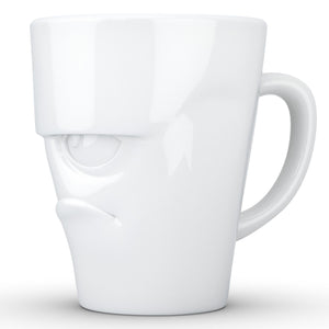 Coffee mug with 'grumpy' facial expression and 11 oz capacity. From the TASSEN product family of fun dishware by FIFTYEIGHT Products. Tall coffee cup with handle in white, crafted from quality porcelain.