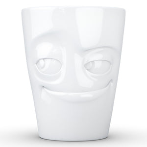 Coffee mug with 'impish' facial expression and 11 oz capacity. From the TASSEN product family of fun dishware by FIFTYEIGHT Products. Tall coffee cup with handle in white, crafted from quality porcelain.