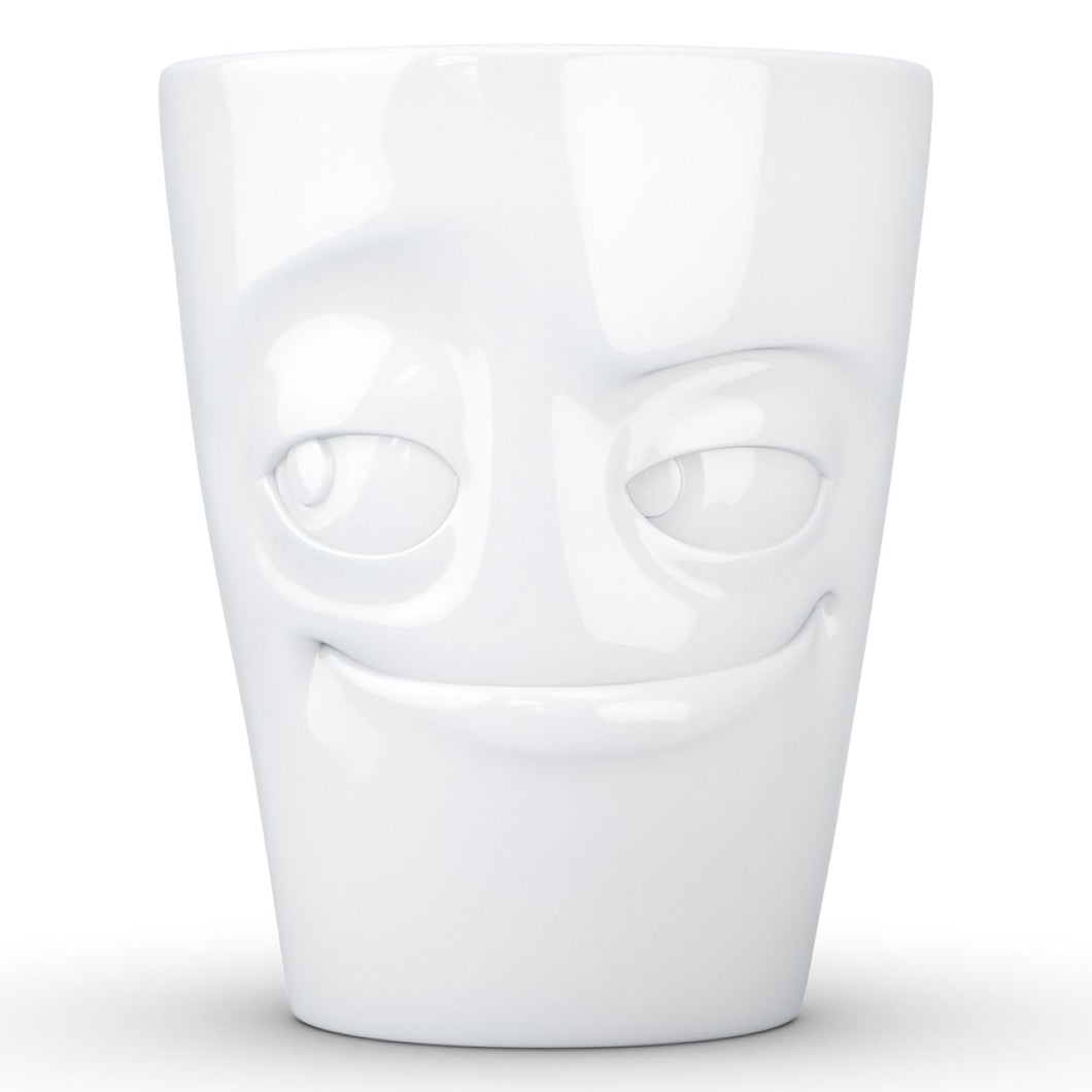 Coffee mug with 'impish' facial expression and 11 oz capacity. From the TASSEN product family of fun dishware by FIFTYEIGHT Products. Tall coffee cup with handle in white, crafted from quality porcelain.