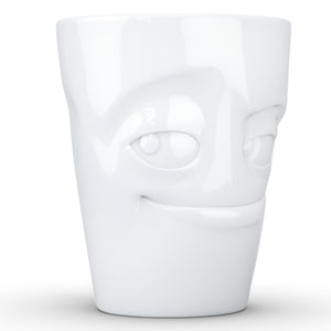 Coffee mug with 'impish' facial expression and 11 oz capacity. From the TASSEN product family of fun dishware by FIFTYEIGHT Products. Tall coffee cup with handle in white, crafted from quality porcelain.