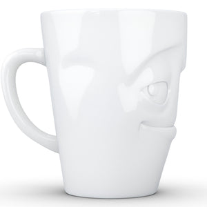 Coffee mug with 'impish' facial expression and 11 oz capacity. From the TASSEN product family of fun dishware by FIFTYEIGHT Products. Tall coffee cup with handle in white, crafted from quality porcelain.