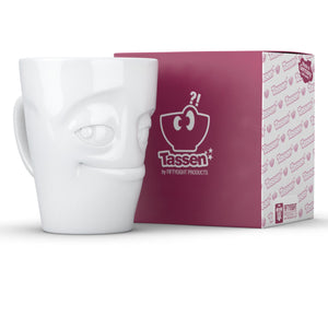 Coffee mug with 'impish' facial expression and 11 oz capacity. From the TASSEN product family of fun dishware by FIFTYEIGHT Products. Tall coffee cup with handle in white, crafted from quality porcelain.