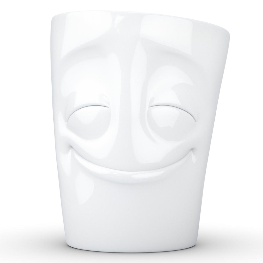 Coffee mug with 'cheery' facial expression and 11 oz capacity. From the TASSEN product family of fun dishware by FIFTYEIGHT Products. Tall coffee cup with handle in white, crafted from quality porcelain.