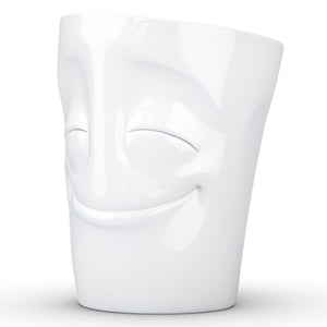 Coffee mug with 'cheery' facial expression and 11 oz capacity. From the TASSEN product family of fun dishware by FIFTYEIGHT Products. Tall coffee cup with handle in white, crafted from quality porcelain.