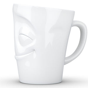 Coffee mug with 'cheery' facial expression and 11 oz capacity. From the TASSEN product family of fun dishware by FIFTYEIGHT Products. Tall coffee cup with handle in white, crafted from quality porcelain.