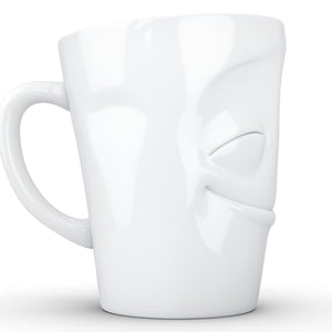 Coffee mug with 'cheery' facial expression and 11 oz capacity. From the TASSEN product family of fun dishware by FIFTYEIGHT Products. Tall coffee cup with handle in white, crafted from quality porcelain.