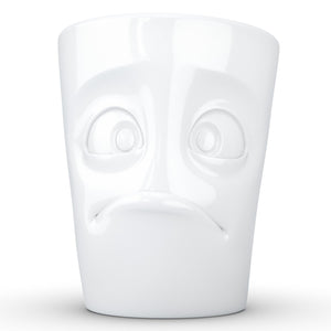 Coffee mug with 'baffled' facial expression and 11 oz capacity. From the TASSEN product family of fun dishware by FIFTYEIGHT Products. Tall coffee cup with handle in white, crafted from quality porcelain.