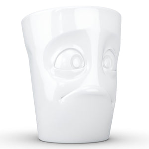 Coffee mug with 'baffled' facial expression and 11 oz capacity. From the TASSEN product family of fun dishware by FIFTYEIGHT Products. Tall coffee cup with handle in white, crafted from quality porcelain.