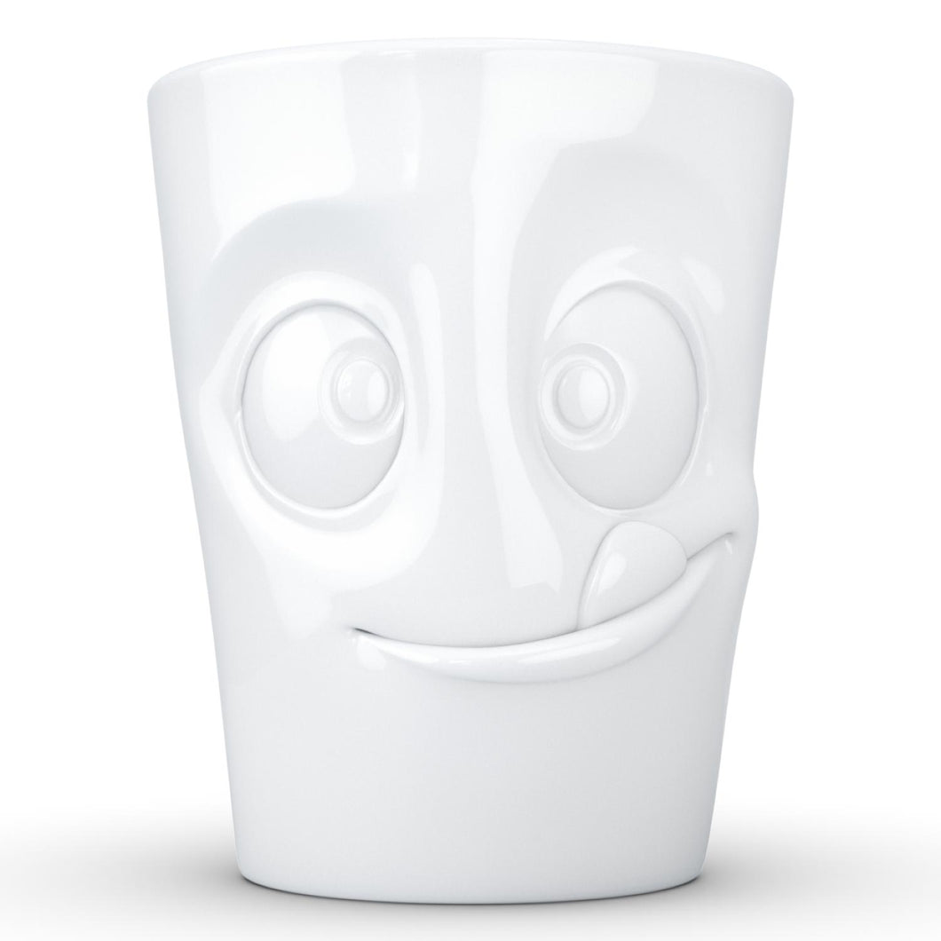 Coffee mug with 'tasty' facial expression and 11 oz capacity. From the TASSEN product family of fun dishware by FIFTYEIGHT Products. Tall coffee cup with handle in white, crafted from quality porcelain.