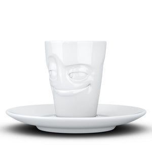 Espresso cup with 'impish' facial expression and 2.7 oz capacity. From the TASSEN product family of fun dishware by FIFTYEIGHT Products. Espresso mug with matching saucer crafted from quality porcelain.