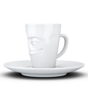 Espresso cup with 'impish' facial expression and 2.7 oz capacity. From the TASSEN product family of fun dishware by FIFTYEIGHT Products. Espresso mug with matching saucer crafted from quality porcelain.