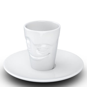 Espresso cup with 'impish' facial expression and 2.7 oz capacity. From the TASSEN product family of fun dishware by FIFTYEIGHT Products. Espresso mug with matching saucer crafted from quality porcelain.