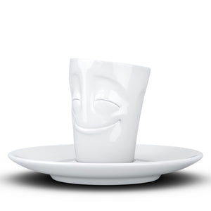 Espresso cup with 'cheery' facial expression and 2.7 oz capacity. From the TASSEN product family of fun dishware by FIFTYEIGHT Products. Espresso mug with matching saucer crafted from quality porcelain.