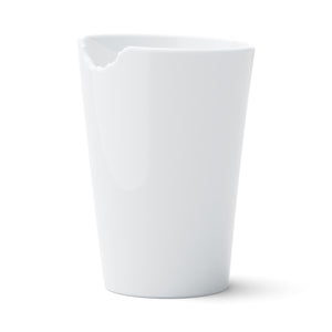 Premium porcelain coffee mug with a 'bite' mark and no handle from the TASSEN product family of fun dishware by FIFTYEIGHT Products. Offers 13.5 oz capacity for serving coffee, tea, latte, matcha, soup and more. Dishwasher and microwave safe.