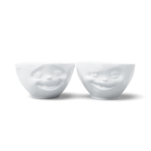 Set of two 6.5 oz. bowls in white from the TASSEN product family featuring sculpted Laughing and Winking faces.