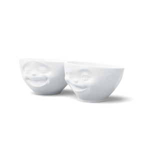 Set of two 6.5 oz. bowls in white from the TASSEN product family featuring sculpted Laughing and Winking faces.