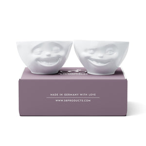 Set of two 6.5 oz. bowls in white from the TASSEN product family featuring sculpted Laughing and Winking faces.