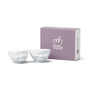 Set of two 6.5 oz. bowls in white from the TASSEN product family featuring sculpted Laughing and Winking faces.